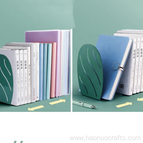 L-shaped students' books stand on the table